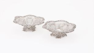 A PAIR OF VICTORIAN SILVER SHAPED CIRCULAR PIERCED BASKETS