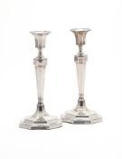 A PAIR OF SILVER OCTAGONAL CANDLESTICKS