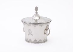 A SILVER CIRCULAR BOX AND COVER