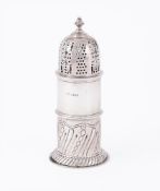 AN EDWARDIAN SILVER LIGHT HOUSE SUGAR CASTER