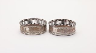 A PAIR OF GEORGE III SILVER WINE COASTERS