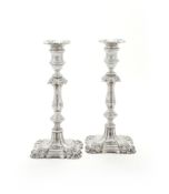 A PAIR OF SILVER CANDLESTICKS