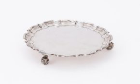 A SILVER SHAPED CIRCULAR SALVER
