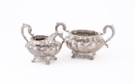 A WILLIAM IV IRISH SILVER LOBED CIRCULAR SUGAR BOWL AND CREAM JUG