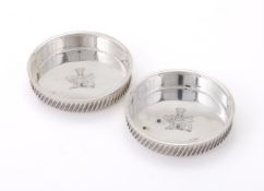 A PAIR OF SILVER COASTERS