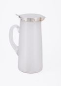 A SILVER MOUNTED AND ETCHED GLASS TAPERING JUG