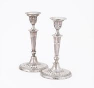 A PAIR OF EDWARDIAN SILVER CANDLESTICKS
