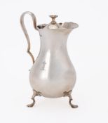 AN EDWARDIAN SILVER BALUSTER JUG