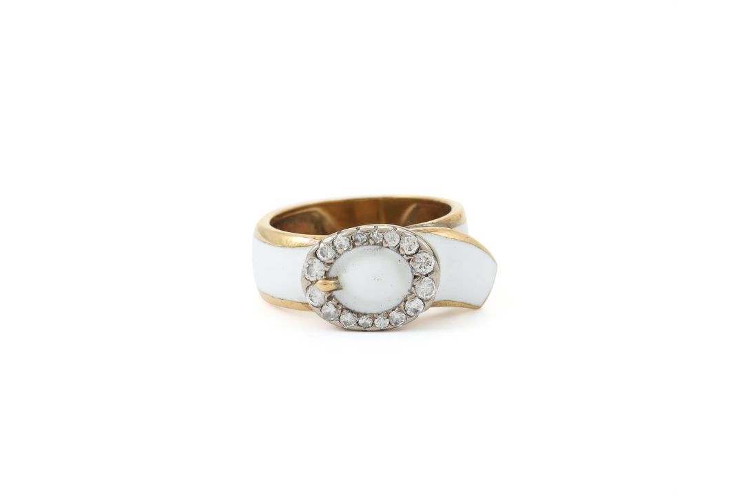 A DIAMOND AND WHITE ENAMEL DRESS RING - Image 1 of 2