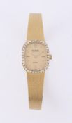 TUDOR, A LADY'S 18 CARAT GOLD AND DIAMOND BRACELET WATCH