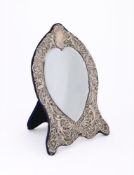 A LARGE VICTORIAN SILVER MOUNTED MIRROR