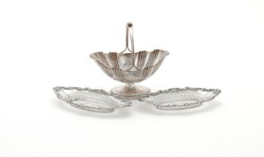 AN EDWARDIAN SILVER OVAL PEDESTAL BASKET