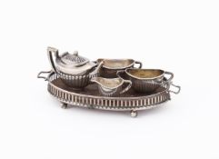 AN EDWARDIAN SILVER MINIATURE FOUR PIECE TEA SET AND TRAY