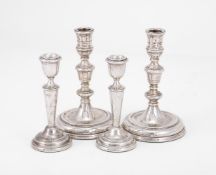 A PAIR OF SILVER CANDLESTICKS