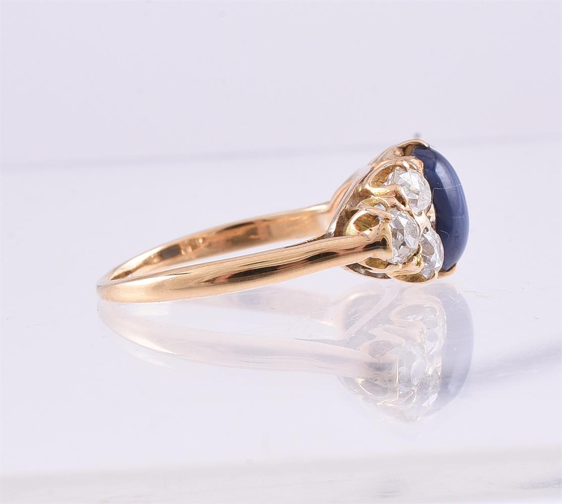 A DIAMOND AND SYNTHETIC STAR SAPPHIRE SEVEN STONE RING - Image 2 of 2