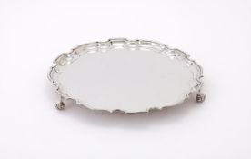 A SILVER SHAPED CIRCULAR SALVER