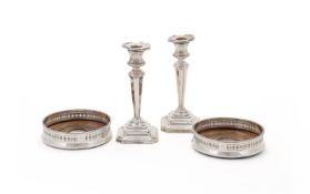 A PAIR OF SILVER BOTTLE COASTERS