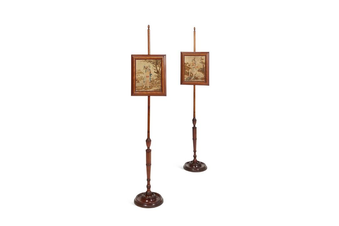 A PAIR OF MAHOGANY POLE SCREENS IN REGENCY STYLE
