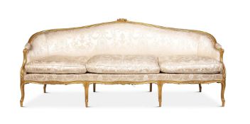 A LOUIS XV CARVED GILTWOOD AND UPHOLSTERED CANAPE CIRCA 1770 AND LATER