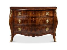 A GEORGE III FIGURED MAHOGANY CROSSBANDED AND ORMOLU MOUNTED BOMBE COMMODE CIRCA 1780