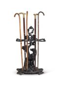 A CAST IRON STICK STAND, 20TH CENTURY