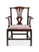 A GEORGE III MAHOGANY OPEN ARMCHAIR