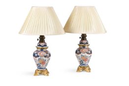 A PAIR JAPANESE OR SAMSON IMARI OCTAGONAL BALUSTER VASES AND COVERS, 19TH CENTURY