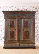 A GREEN AND POLYCHROME PAINTED WARDROBE, 18TH CENTURY
