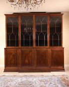 A MAHOGANY BREAKFRONT LIBRARY BOOKCASE IN GEORGE III STYLE, 19TH CENTURY