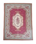 AN AUBUSSON STYLE WOVEN RUG