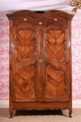 A LOUIS XV FRUITWOOD AND GILT METAL MOUNTED ARMOIRE, CIRCA 1750