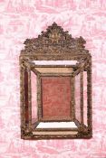 A DUTCH REPOUSSÉ GILT BRASS MARGINAL MIRROR IN THE 17TH CENTURY TASTE