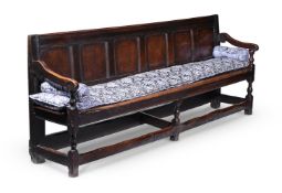 AN OAK SETTLE, EARLY 18TH CENTURY