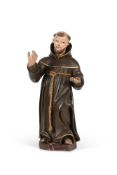 A CARVED AND POLYCHROME PAINTED MODEL OF A MONK, 19TH CENTURY