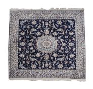 A TABRIZ PART SILK RUG