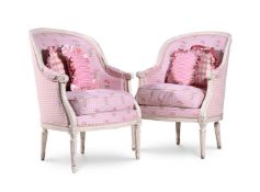 A PAIR OF WHITE PAINTED AND PINK UPHOLSTERED ARMCHAIRS IN FRENCH TASTE, 20TH CENTURY