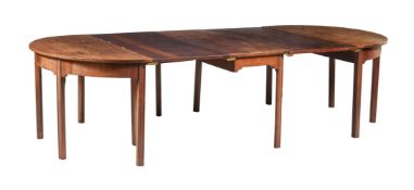 A GEORGE III MAHOGANY DINING TABLE