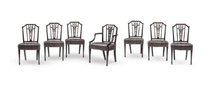 A SET OF SEVEN MAHOGANY DINING CHAIRS IN GEORGE III STYLE