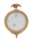 A GILTWOOD CONVEX WALL MIRROR