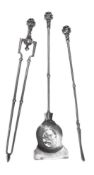 A SET OF THREE POLISHED STEEL FIRE TOOLS