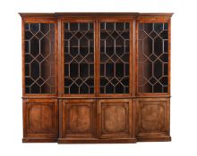 A MAHOGANY BREAK FRONT BOOK CASE IN GEORGE III STYLE