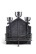 AN ARTS AND CRAFTS WROUGHT IRON FIREGRATE PROBABLY RETAILED BY LIBERTY & CO.
