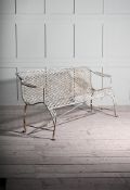 A WHITE PAINTED WROUGHT IRON GARDEN BENCH IN REGENCY STYLE, 20TH CENTURY