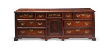 A GEORGE II OAK AND CROSSBANDED DRESSER BASE, CIRCA 1750