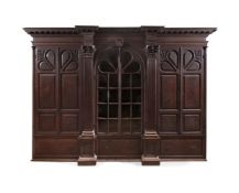 A RARE GEORGE II CARVED OAK BREAKFRONT BOOKCASE, CIRCA 1740