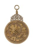 A DECORATIVE ISLAMIC BRASS ASTROLABE