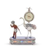 A SILVER, GEM SET AND ENAMEL DESK CLOCK