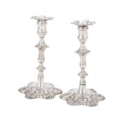 A PAIR OF GEORGE II CAST SILVER CANDLESTICKS