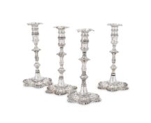 A SET OF FOUR GEORGE III IRISH SILVER CANDLESTICKS