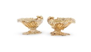 A PAIR OF SILVER GILT SHELL SHAPED PEDESTAL SALTS